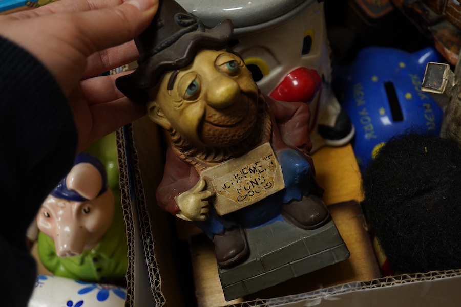 A large quantity (in three boxes) of novelty, advertising and general money boxes mostly from the mid to late 20th century, tallest a clown Ellgreave money box 27cm high. Condition - varied from poor to good